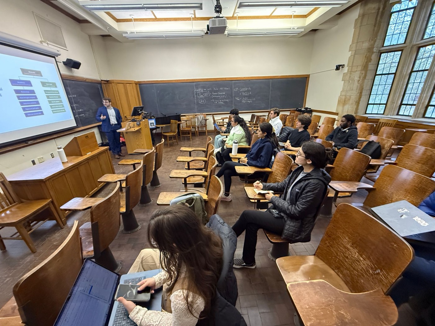 Alessandro Zulli presenting on biosecurity to students in a Yale lecture hall
